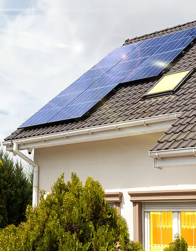 House With Solar Panels On Roof